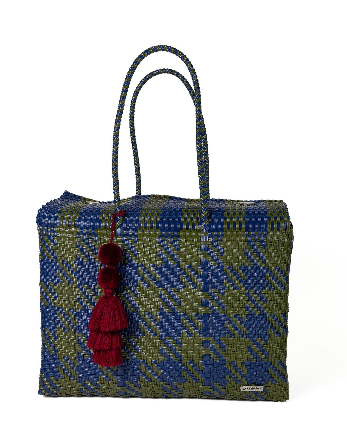 A woven tote bag featuring a blue and olive green plaid pattern, dual braided shoulder straps, and a decorative dark red tassel charm, shown against a plain white background.