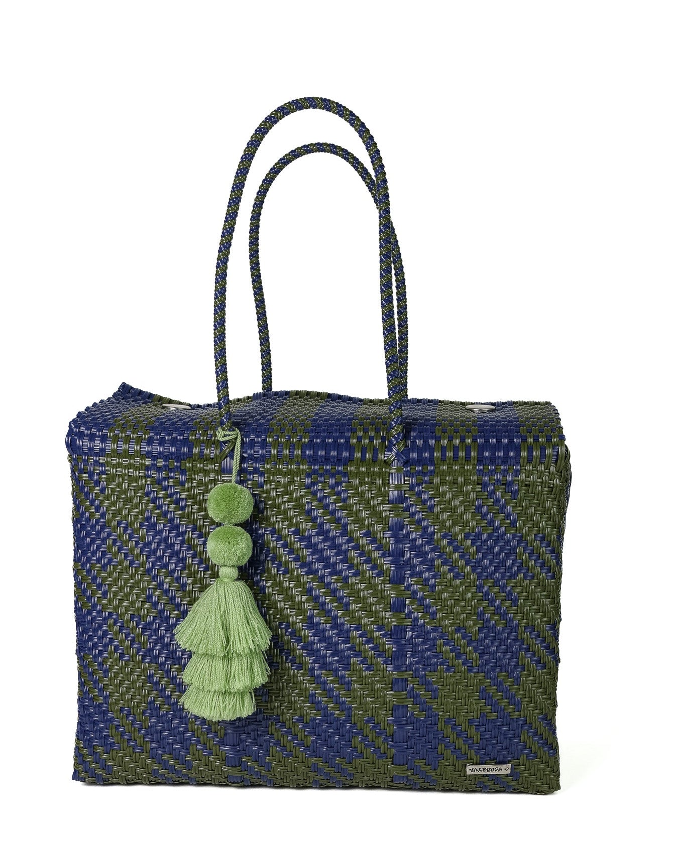 A woven tote bag featuring a blue and olive green plaid pattern, with dark blue braided shoulder straps and a light green tassel charm.